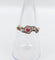 Bague 55 Bague marguerite antique or rose, rubis et diamants (c.1890) 58 Facettes A05453