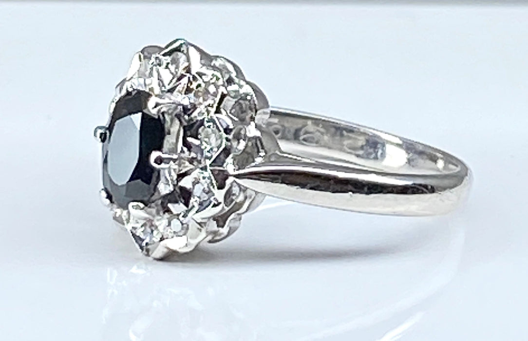 White gold sapphire and 10 diamond ring