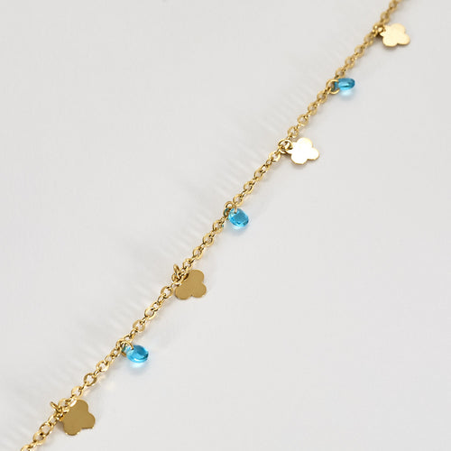 Nilkkaketju keltaista kultaa ja topaaseja 