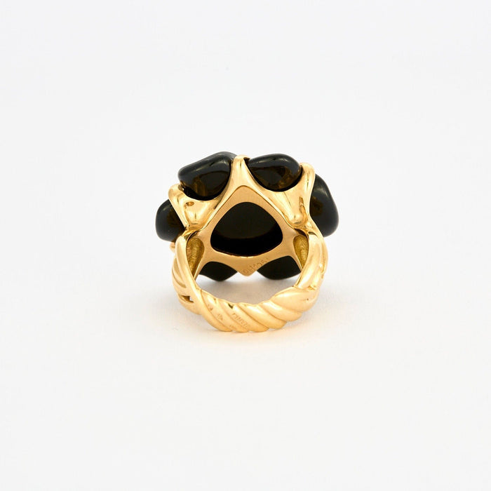 Bague 56 CHANEL - Bague Camélia or jaune onyx 58 Facettes 120