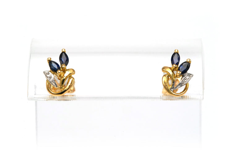 Boucles d'oreilles Boucles d'oreilles contemporaines en or jaune et blanc 18 carats serties de saphirs 58 Facettes 22580