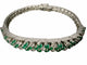 Bracelet Bracelet or blanc orné d'un pavage de brillants et émeraudes 58 Facettes