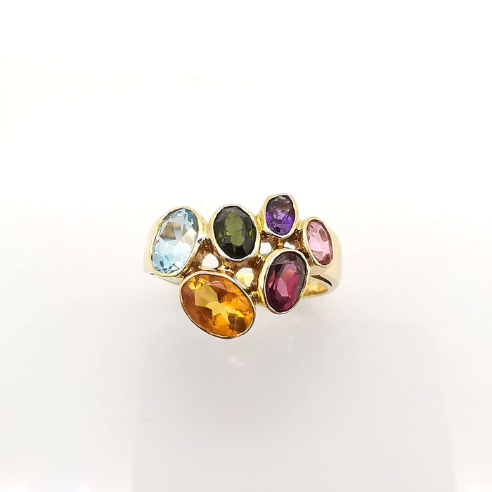 Yellow gold ring with precious stones