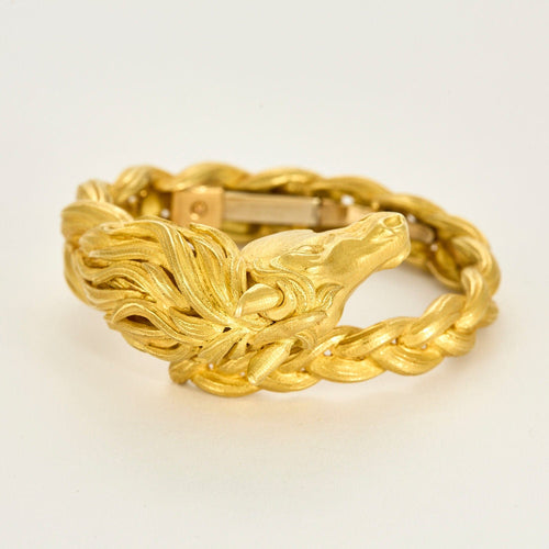 HERMES - Pulseira rígida em ouro amarelo com motivo de cavalo 