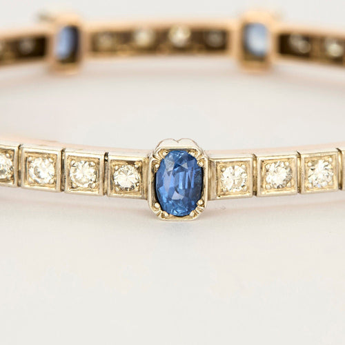 Bracelet jonc ouvrant en or jaune et argent, diamants et saphirs 58 Facettes 230460