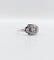 Bague 53 Bague art deco or blanc 18k ornée d'un diamant rond dans une monture géométrique finement travaillée (circa 1930) 58 Facettes A04979