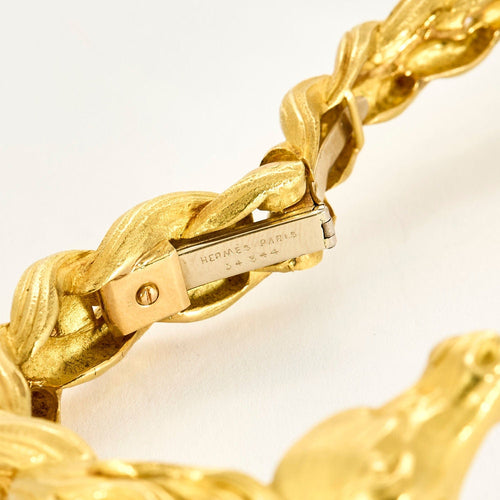 HERMES - Pulseira rígida em ouro amarelo com motivo de cavalo 