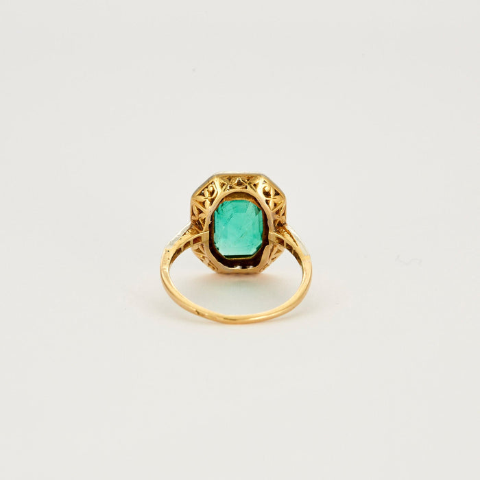 Ring platinum and yellow gold emerald and diamonds