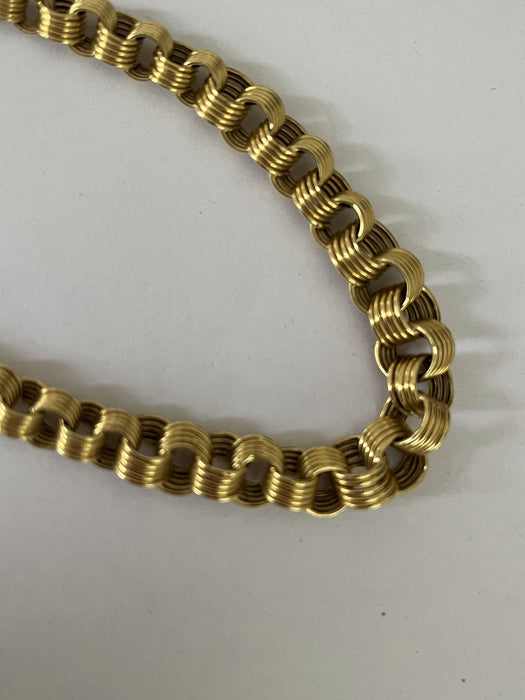 Yellow gold necklace with falling rings