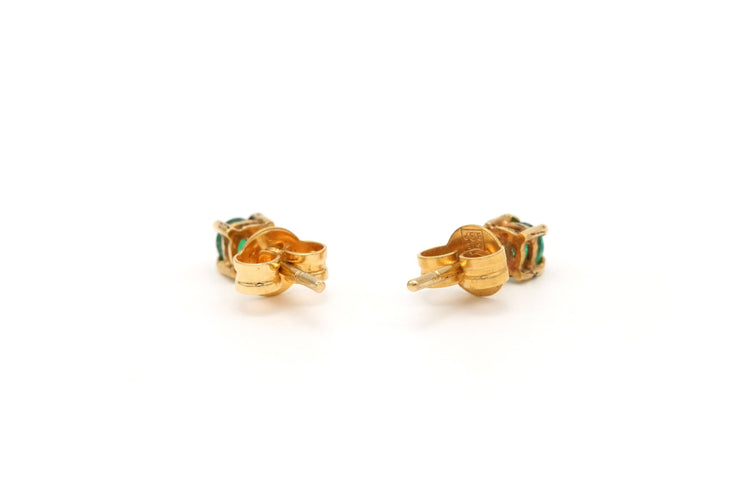 Contemporary earrings in 18-carat yellow gold set with emeralds 
