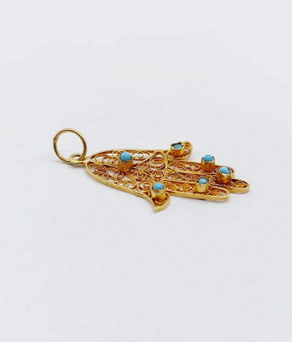 Pendentif Pendentif vintage or jaune Main de fatma orné de turquoises (circa 1950) 58 Facettes A04727