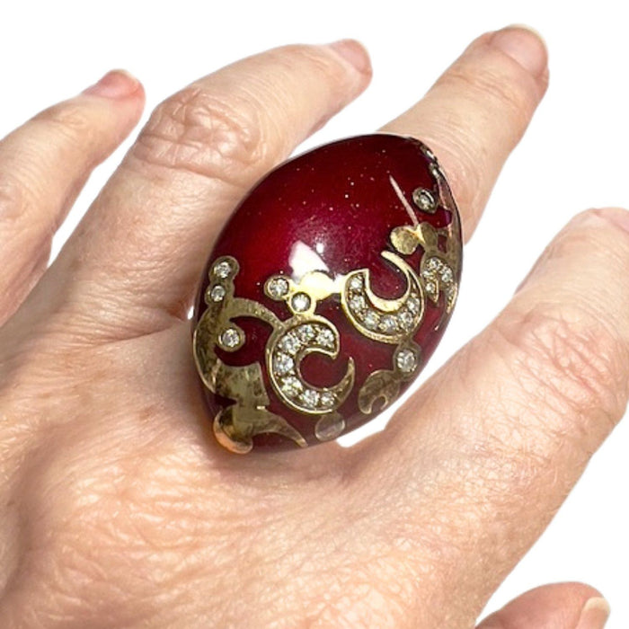 gold ring with diamonds and red enamel