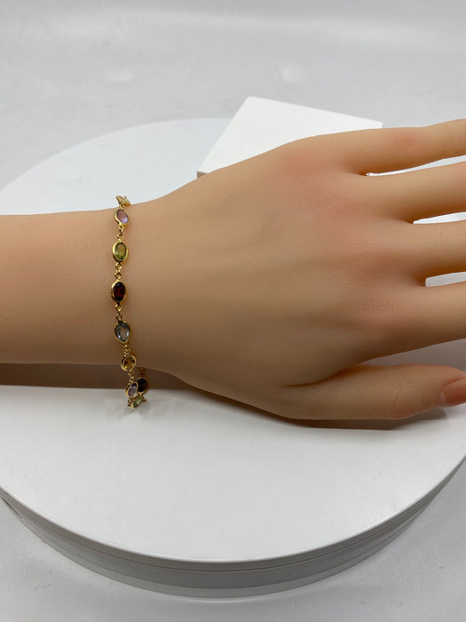 Armband aus Gelbgold und feinen Steinen