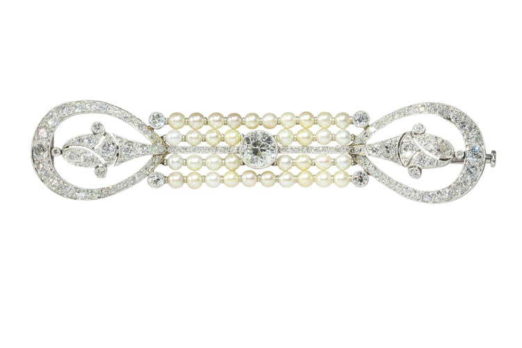 Broche L'élégance d'une époque : une exquise broche en diamants et perles datant de l'aube de l'Art déco 58 Facettes 18115-0042