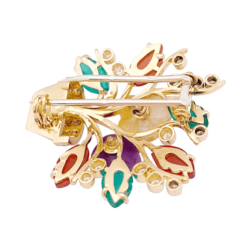 “Fleurs”系列胸针，黄金、钻石、红宝石、彩色宝石。 