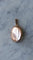 https://cdn.shopify.com/s/files/1/0075/4588/0666/files/medaillon-ancien-cabochon-grenat-et-perles-sur-or-rose-761437.jpg?v=1733305657