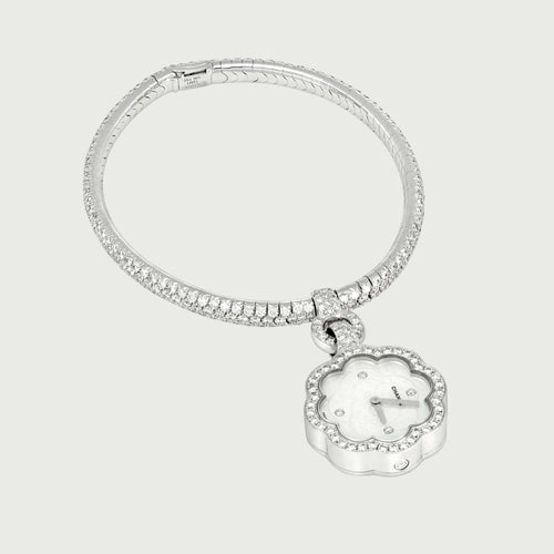 Montre Chanel Camélia - Montre Charm en or blanc et diamants 58 Facettes OC-68801959