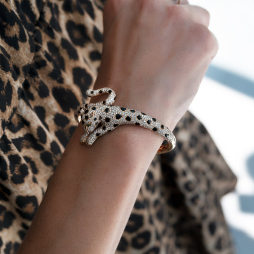 Bracelet Bracelet panthère en or jaune avec onyx, émeraudes et diamants 58 Facettes 62000207