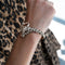 Bracelet Bracelet panthère en or jaune avec onyx, émeraudes et diamants 58 Facettes 62000207