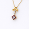 Collier Collier en or jaune 18 carats avec perle, rubis et diamants 58 Facettes 33724