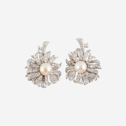 https://reuvenveksler.com/wp-content/uploads/2026/01/pair-of-pearl-and-diamond-flower-earrings-attributed-to-boucheron-front-view-scaled.jpg