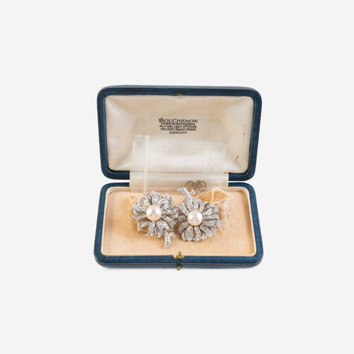 https://reuvenveksler.com/wp-content/uploads/2026/01/pair-of-pearl-and-diamond-flower-earrings-attributed-to-boucheron-in-box-scaled.jpg