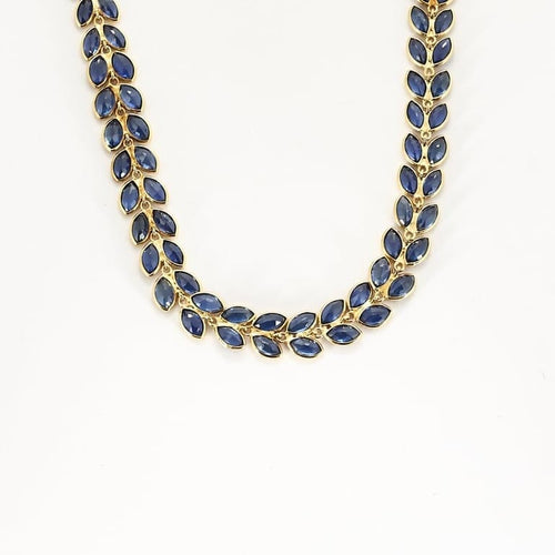 Collier Collier rivière à motif de feuilles en or jaune et saphirs 58 Facettes AUX1455