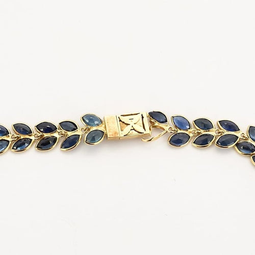 Collier Collier rivière à motif de feuilles en or jaune et saphirs 58 Facettes AUX1455