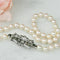 Broche Art déco - Broche en or blanc diamants et perles 58 Facettes 2151