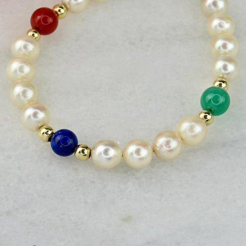 Bracelet Armband en perles, or 14 carats et pierres fines 58 Facettes 2306