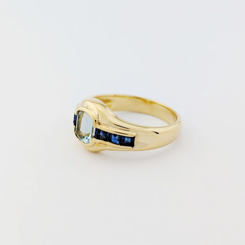 https://18carats.fr/wp-content/uploads/2025/12/33702-34384-Bague-en-or-jaune-saphirs-et-aigue-marine.jpg