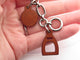 Bracelet Hermès Olga Amulette - Bracelet en cuir Barenia et acier palladié 58 Facettes 265386