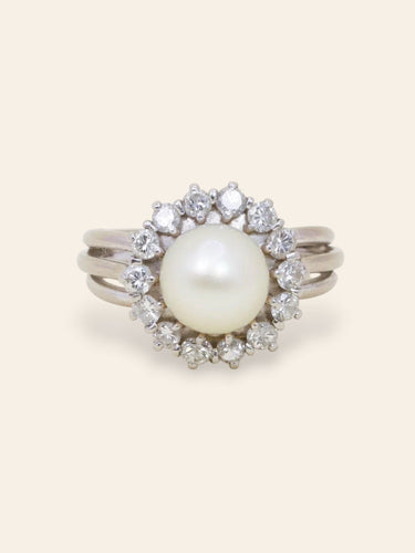 Bague 50 Bague marguerite vintage en or blanc 18 carats avec perle et diamants 58 Facettes 1186.3