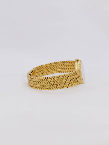 Montre Baume & Mercier - Montre vintage en or jaune 18 carats à maille tressée 58 Facettes 1067.3