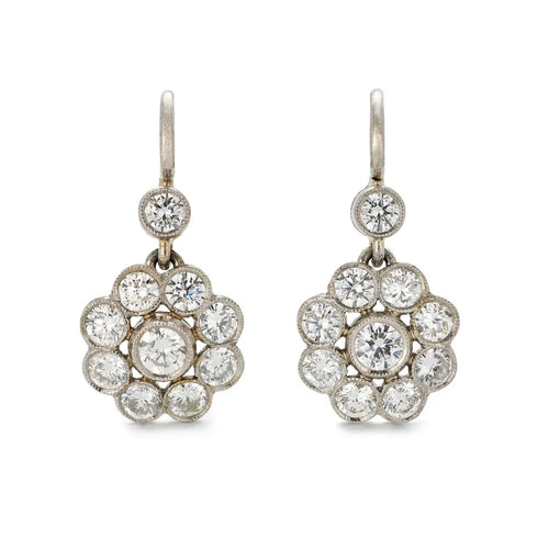 https://cdn.shopify.com/s/files/1/0563/1957/4129/files/VI-0033-Vintage_1.10ct_Diamond_Earrings-Angle_1.webp?v=1752063467