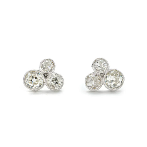 https://cdn.shopify.com/s/files/1/0563/1957/4129/files/EW-0014-Ready_to_Wear_Signature_1.20ct_Diamond_Ear_Studs-Angle_1.webp?v=1749728876