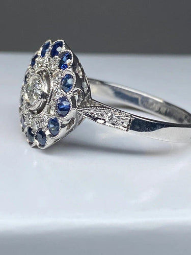 Bague 57 Bague fleur Art déco en or 18 ct, diamants et saphirs 58 Facettes AB45