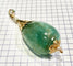 Pendentif Pendentif en or jaune 18 carats à émeraudes et perles 58 Facettes AB479