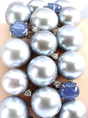 Bracelet Bracelet en or blanc 18 carats, saphirs étoilés, diamants et perles grises 58 Facettes AB632
