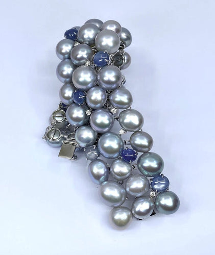 Bracelet Bracelet en or blanc 18 carats, saphirs étoilés, diamants et perles grises 58 Facettes AB632