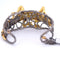 Bracelet Bracelet rigide motif gecko en or 18 carats, diamants et saphirs 58 Facettes BR113