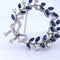 Broche Spilla vintage en or blanc 18 kt avec saphirs et diamants 58 Facettes SP9 '(00029)