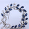 Broche Spilla vintage en or blanc 18 kt avec saphirs et diamants 58 Facettes SP9 '(00029)