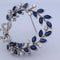 Broche Spilla vintage en or blanc 18 kt avec saphirs et diamants 58 Facettes SP9 '(00029)