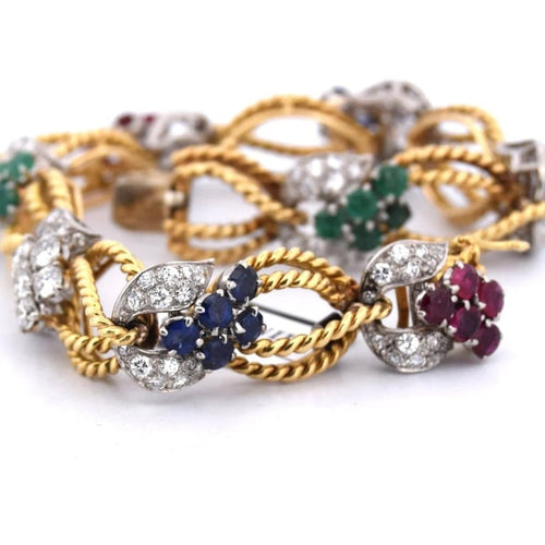 Bracelet Bracelet vintage en or jaune 18 carats avec diamants et pierres de couleur 58 Facettes BR100