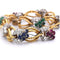 Bracelet Bracelet vintage en or jaune 18 carats avec diamants et pierres de couleur 58 Facettes BR100