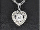 Pendentif Pendentif cœur en or blanc 14 carats avec diamants 58 Facettes 2082