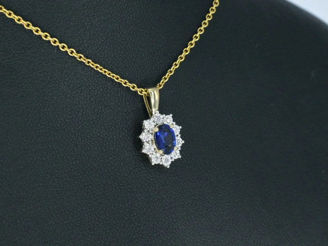 Pendentif Pendentif entourage en or jaune avec diamants et saphir 58 Facettes 2300