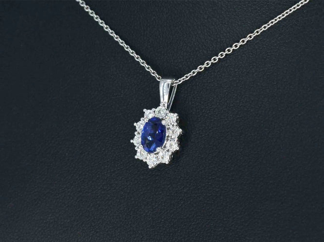 Pendentif Pendentif en or blanc 14 carats avec diamants et saphir 58 Facettes 2299
