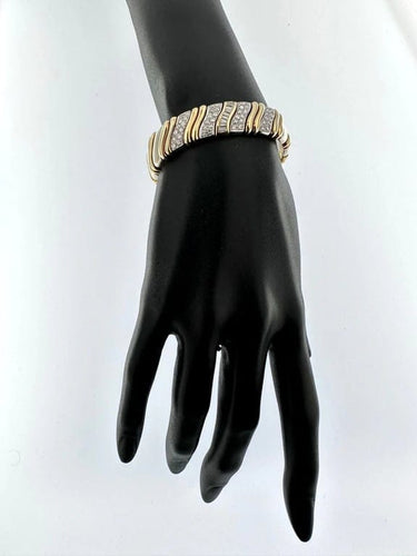 Bracelet Bracelet manchette italien en or jaune et or blanc avec diamants 58 Facettes